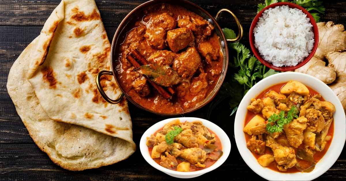 Ingredients for আলু দিয়ে মুরগির ঝোল রেসিপি - chicken, potatoes, onions, tomatoes, spices, mustard oil.